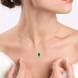 5x3 MM Pear Shape Emerald and 1/20 Ctw Round Cut Diamond Halo Precious Pendant with Chain in 10K Yellow Gold