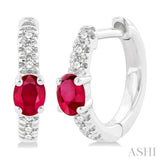 1/10 ctw Petite 4X3MM Oval Cut Ruby and Round Cut Diamond Fashion Huggies in 10K White Gold